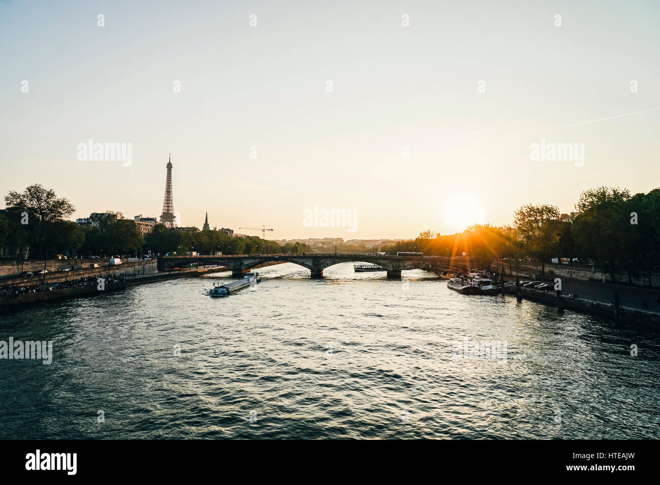 The famous Eiffel Tower and the “Pont des Invalides” bridge in Paris ...