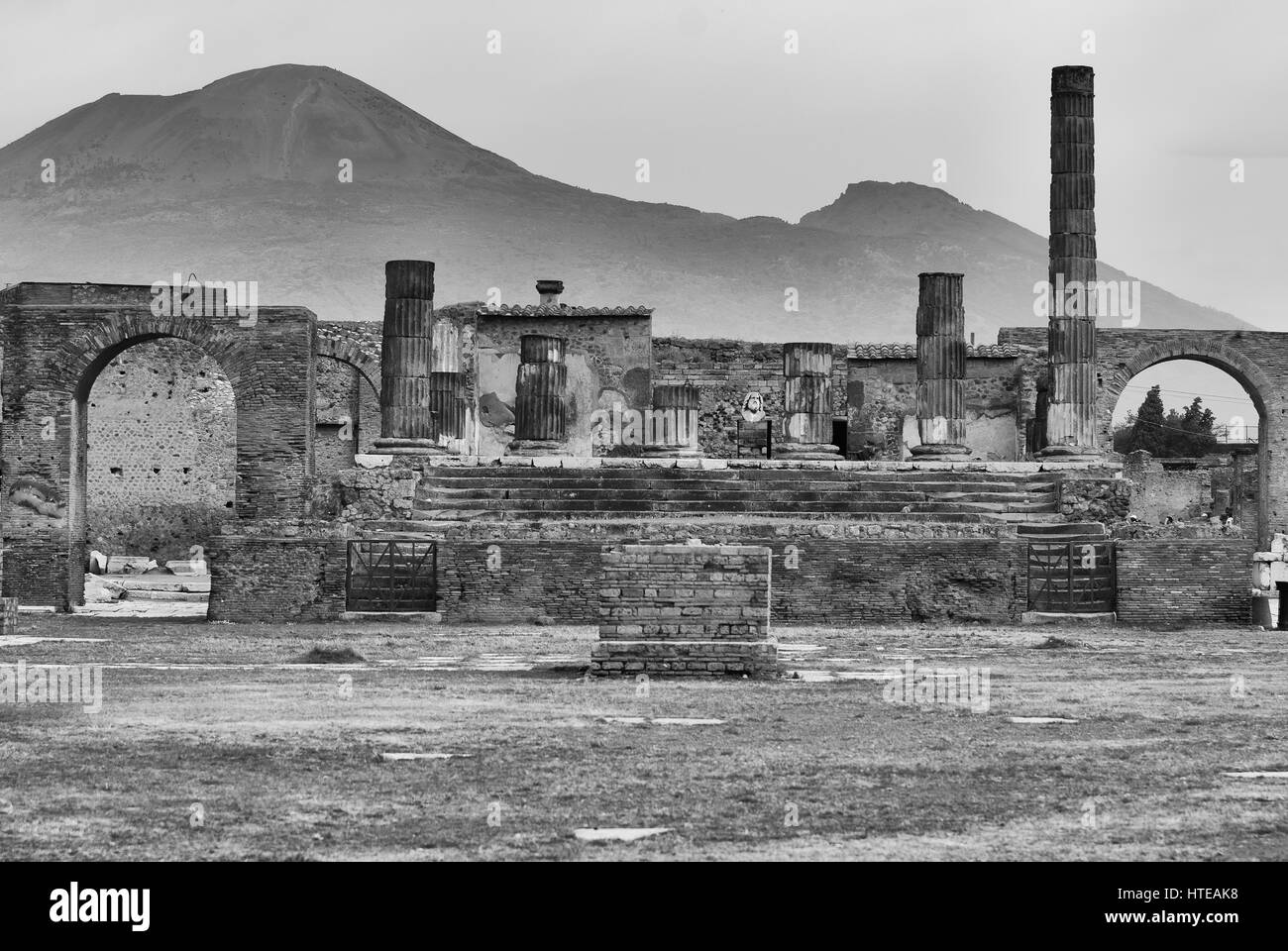 Pompeii,Temple of Jupiter with Vesuvius in the distance. Naples Italy Stock Photo