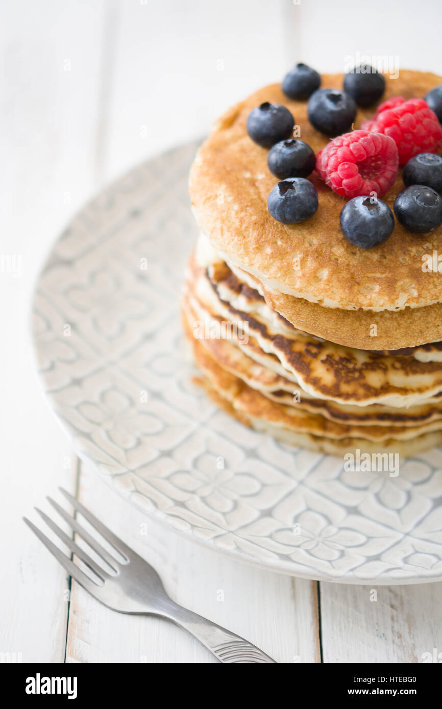 Pancake with blueberries and raspberries on white wood Stock Photo - Alamy