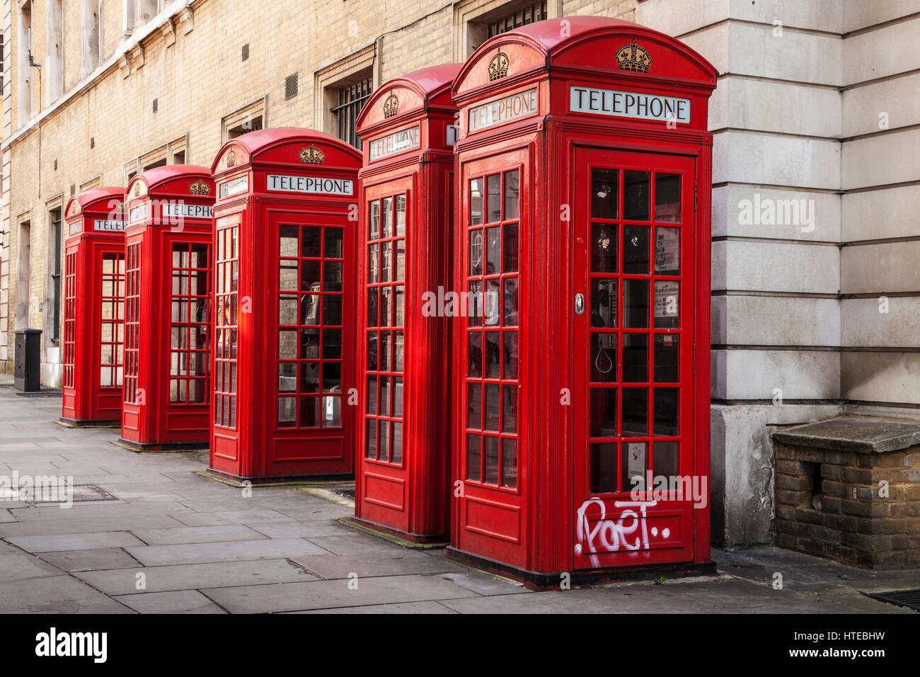A row of red telephone boxes in London. Stock Photo