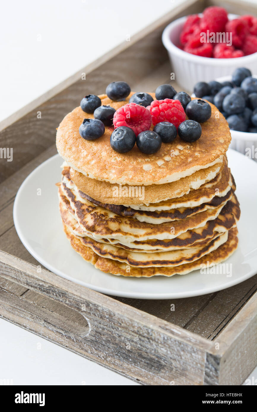 Pancake with blueberries and raspberries on white wood Stock Photo - Alamy