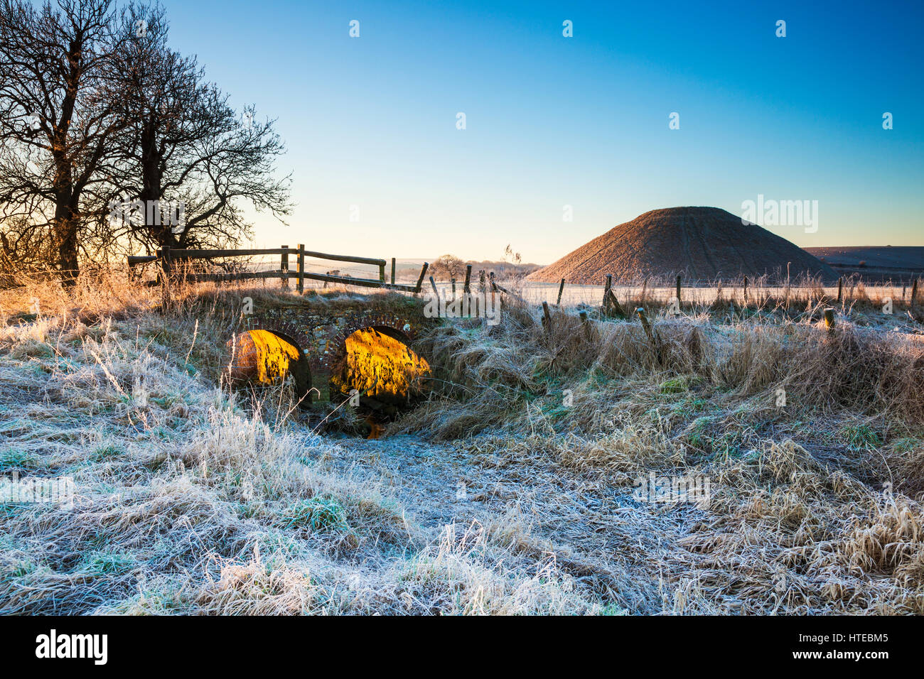 A frosty morning at Silbury Hill in Wiltshire. Stock Photo