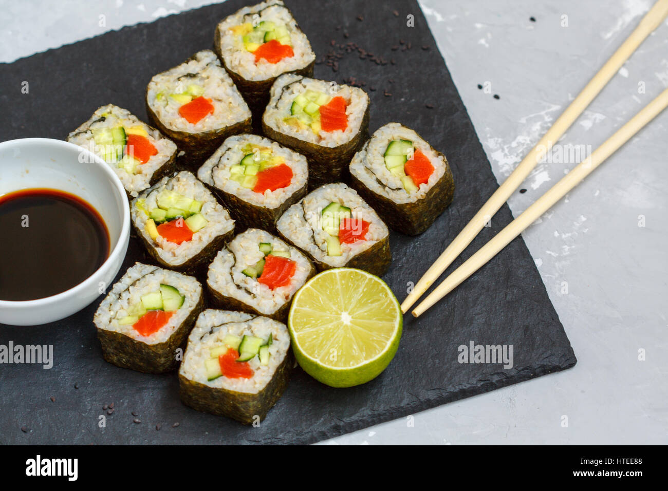 Healthy homemade sushi rolls with brown rice and fish Stock Photo - Alamy