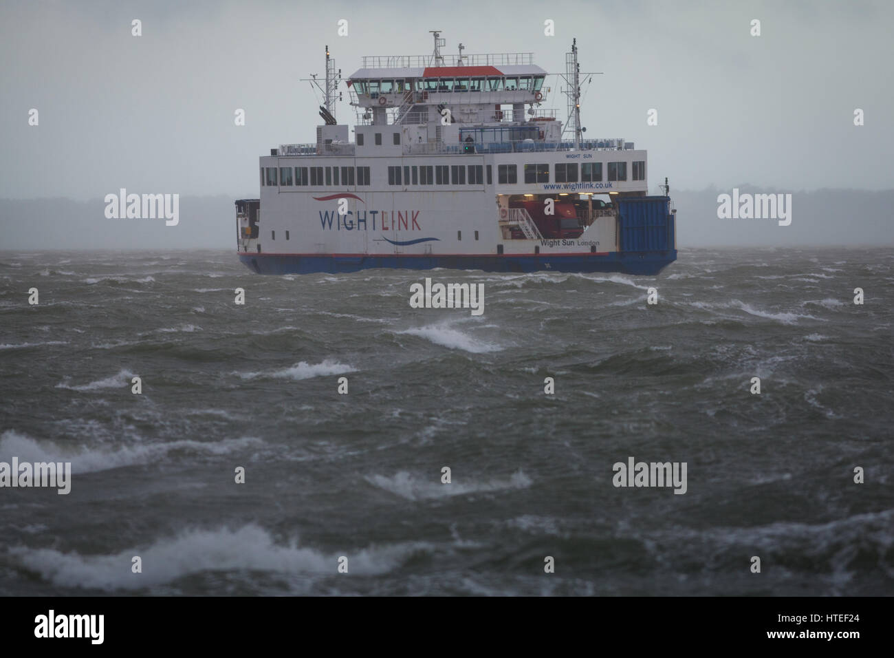 A Wightlink car ferry service facing strong winds and large waves in The Solent as Storm Doris hits Britain in Winter 2017 Stock Photo
