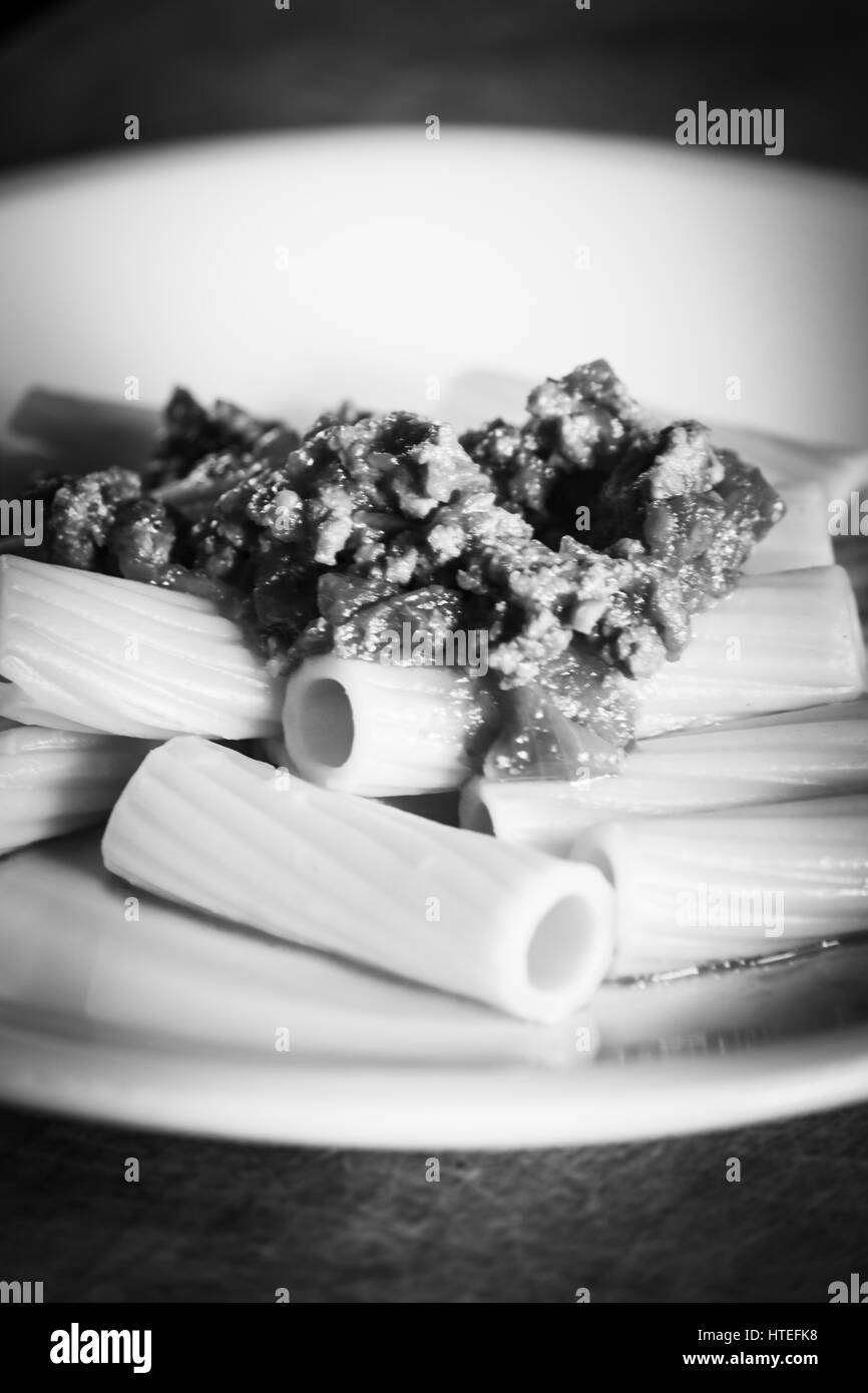 Italian rigatoni pasta with ragù alla bolognese - black and white Stock Photo