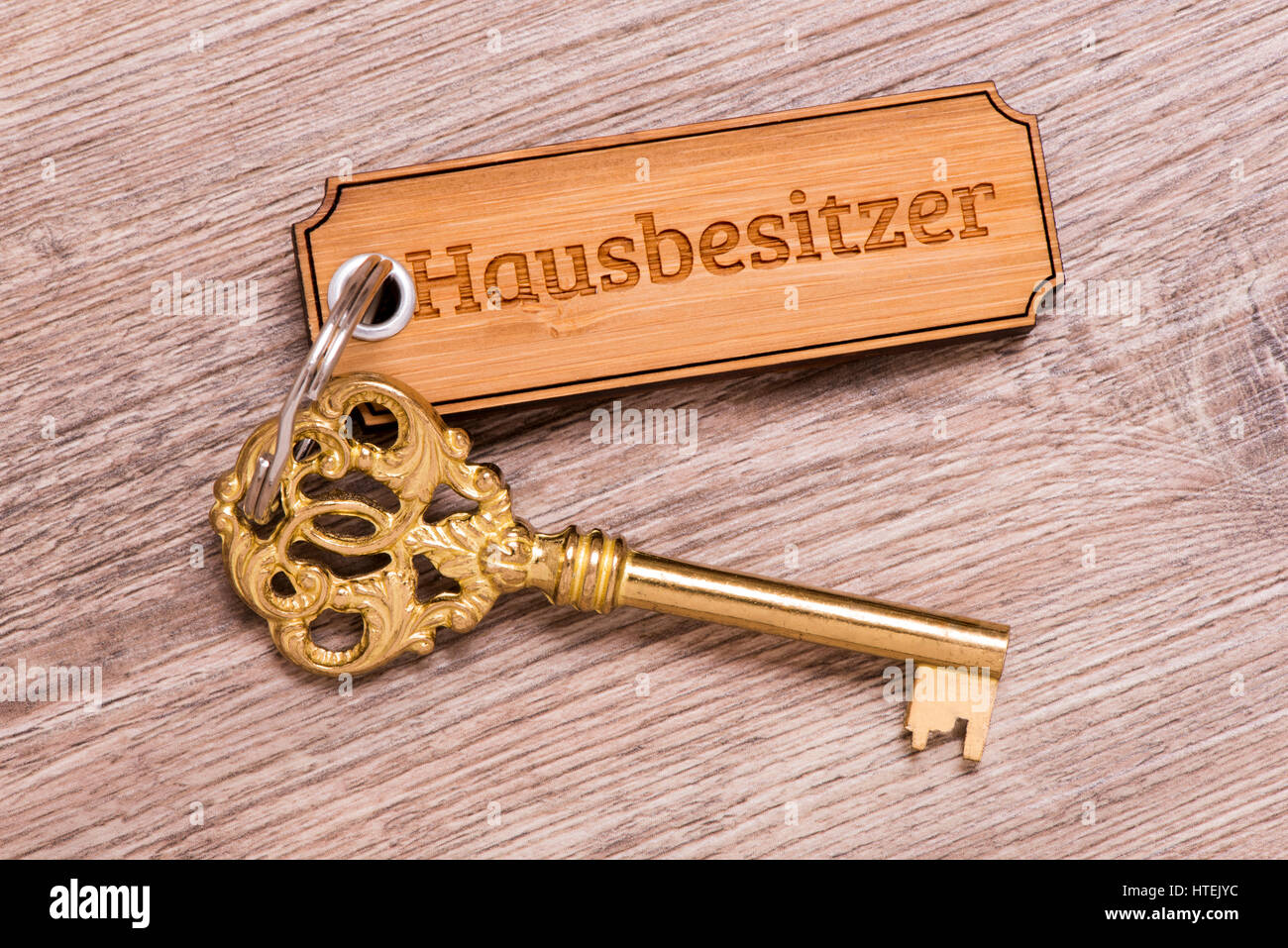 house key on keyring with print in german language for house owner Stock Photo Alamy