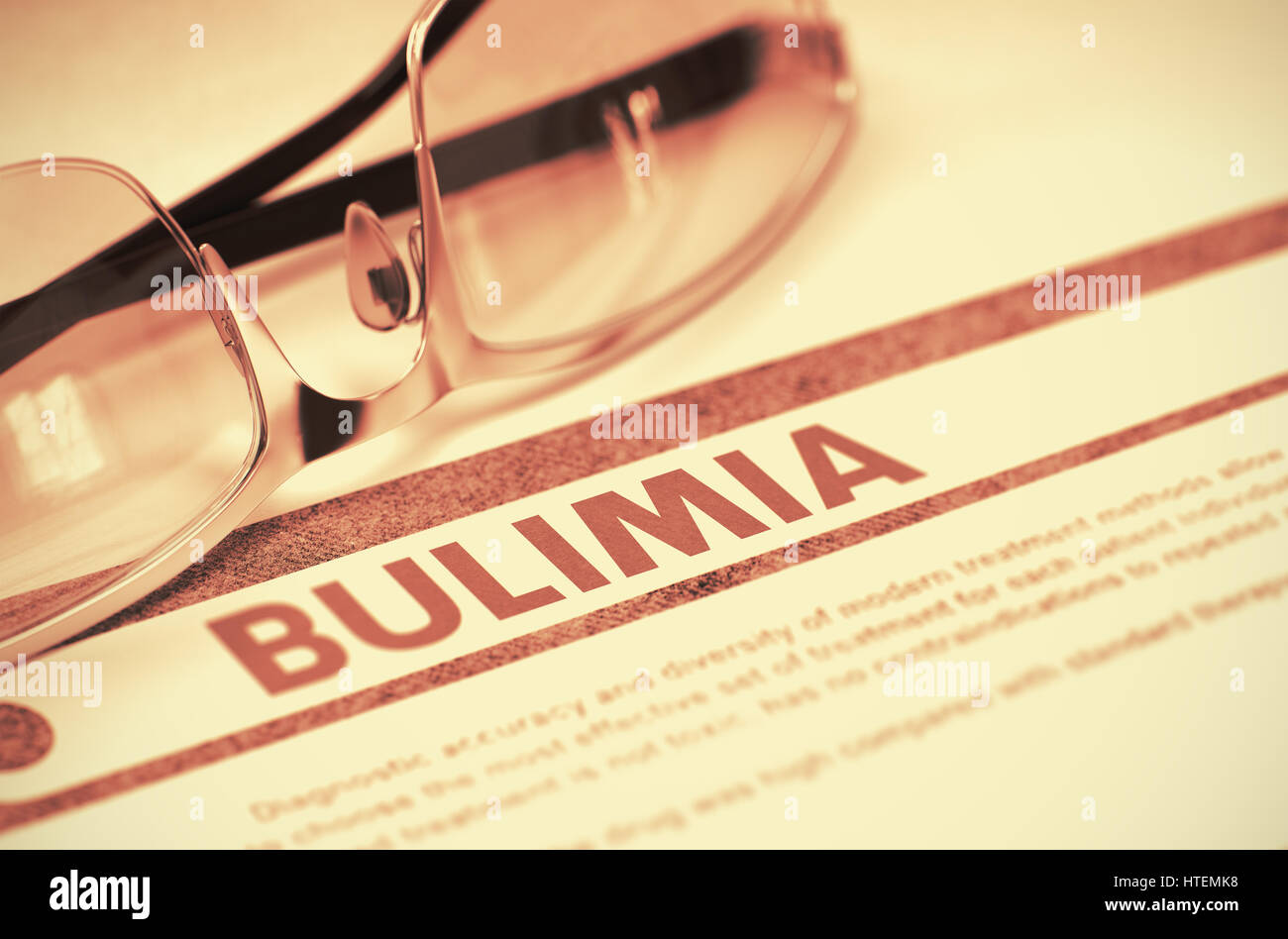 Bulimia - Medical Concept with Blurred Text and Specs on Red Background. Selective Focus. Bulimia - Printed Diagnosis with Blurred Text on Red Backgro Stock Photo