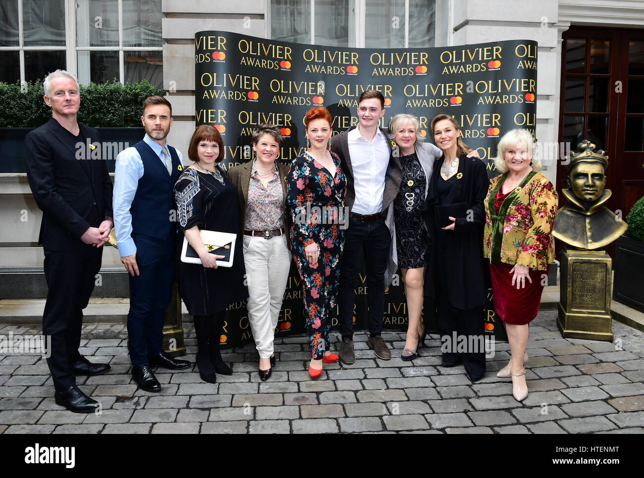 The Cast and Crew of The Girls (left to right) Tim Firth, Gary Barlow, Debbie Chazen, Claire Machin, Sophie-Louise Dann, Claire Moore, Joanna Riding and Michele Dotrice arriving at the Olivier Awards Nominations Party held at the Rosewood, London. Stock Photo