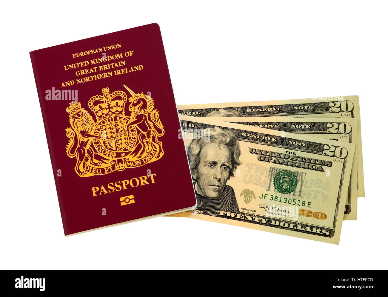 A European Union passport issued in the United Kingdom and three 20 Dollar bills, (USA) Stock Photo