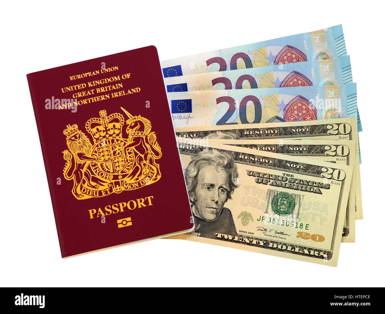 A European Union passport issued in the United Kingdom with three  20 Euro banknotes and three 20 USA Dollar banknotes Stock Photo