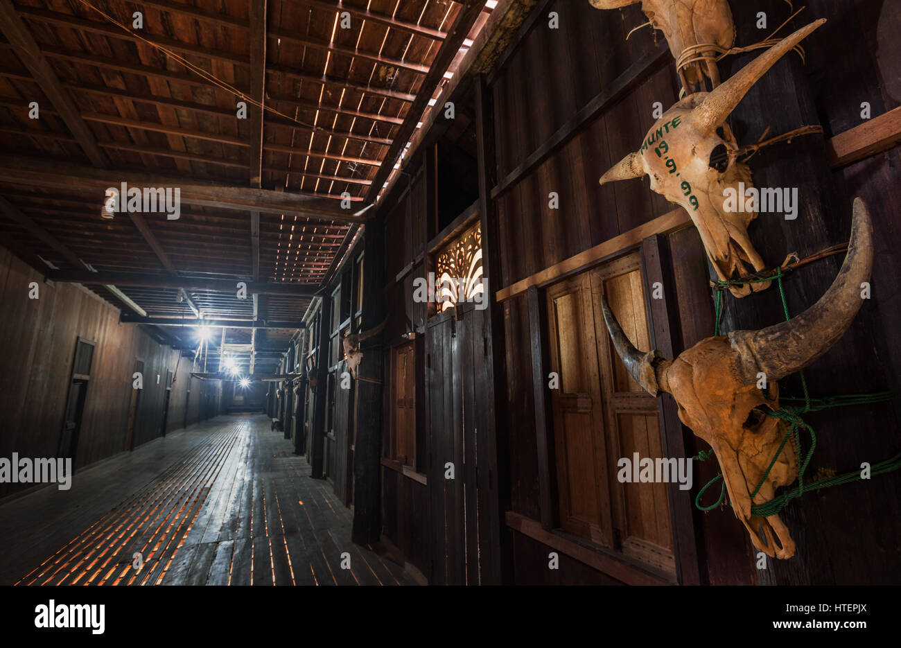 Authentic Dayak Longhouse interior made entirely of Bornean Ironwood in Kalimantan, Indonesia Stock Photo