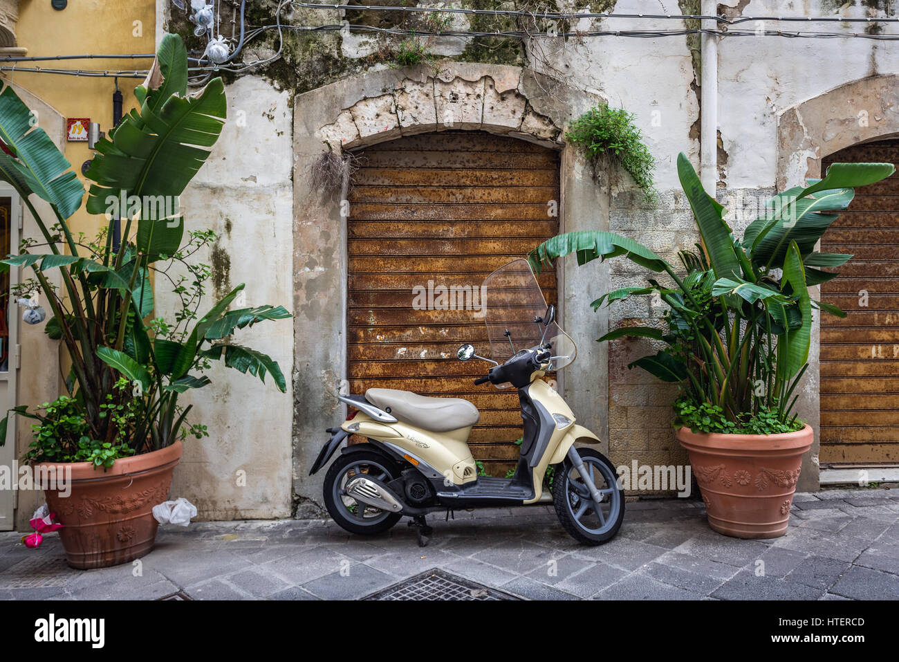Piaggio Liberty 125 scooter on the Ortygia island, historical part of Syracuse city, southeast corner of the island of Sicily, Italy Stock Photo