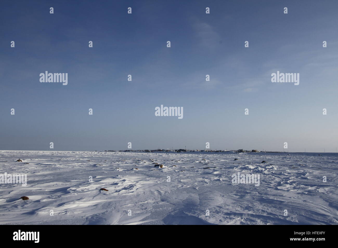 View of Arviat, Nunavut with snow landscape Stock Photo Alamy