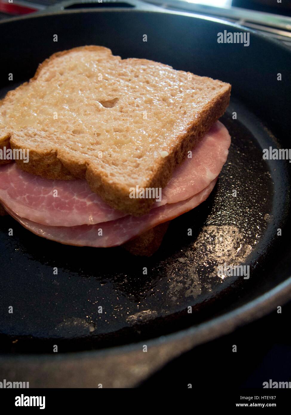Ingredients and making of a croque monsieur French ham and cheese sandwich, toasted, meal, gruyere, Stock Photo