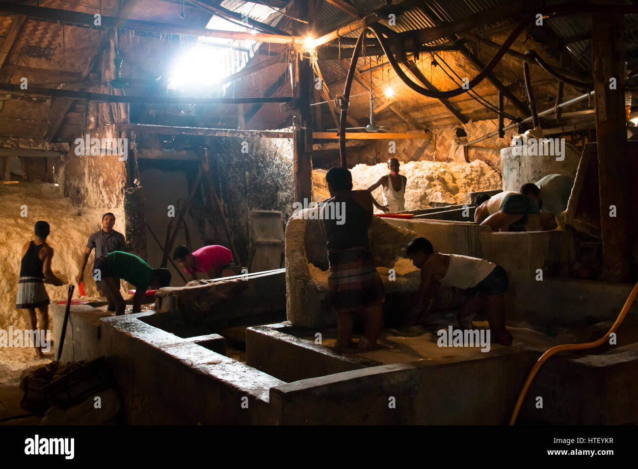 CHITTAGONG, BANGLADESH FEBRUARY 2017 Men cleaning salt in a factory