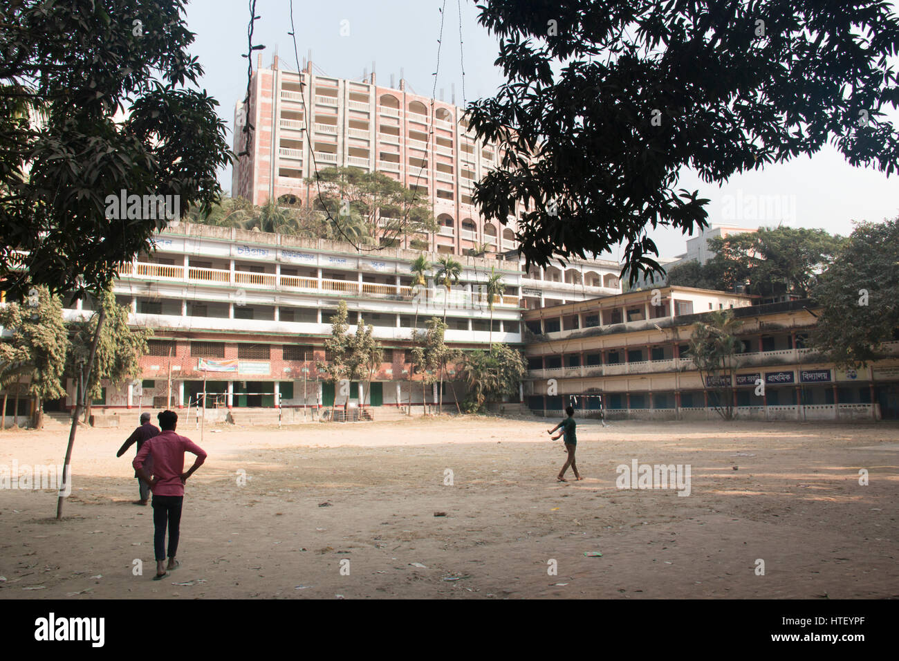 CHITTAGONG, BANGLADESH - FEBRUARY 2017: Children playing cricket in an old school in Chittagong in Bangladesh Stock Photo