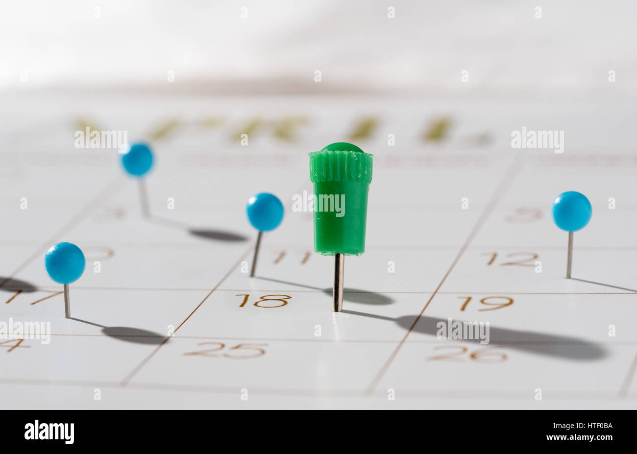 Calendar with push pins with focus showing tax day for filing is April 18 2017 Stock Photo