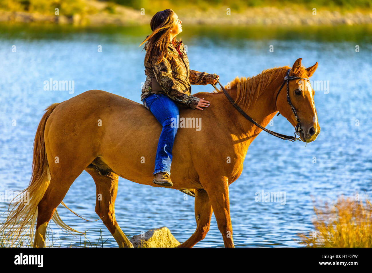 Horse back riding by Patricia Lake, Jasper National Park Stock Photo