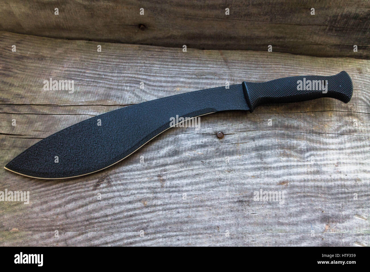Kukri. Large knife. Machete. Top view. Large knife for rural work. Knife for cutting brushwood. Stock Photo