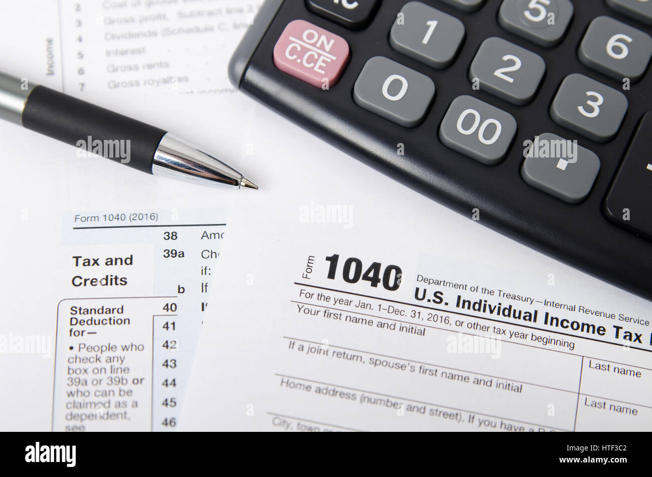 US tax form 1040 with pen and calculator. tax form law document usa