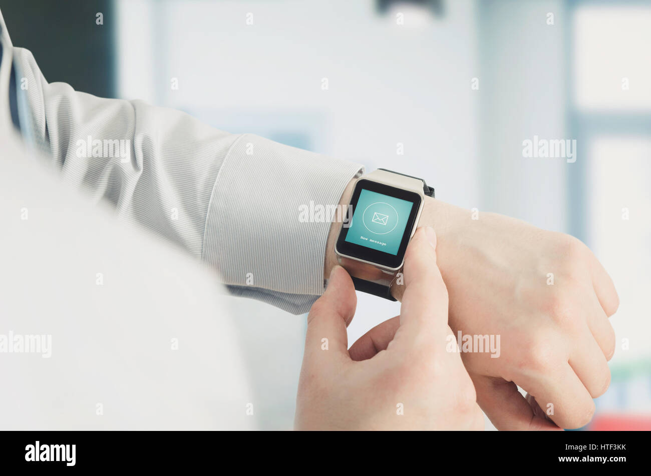 Man using smartwatch with e-mail notifier. smartwatch hand device notify computer internet message e-mail concept Stock Photo