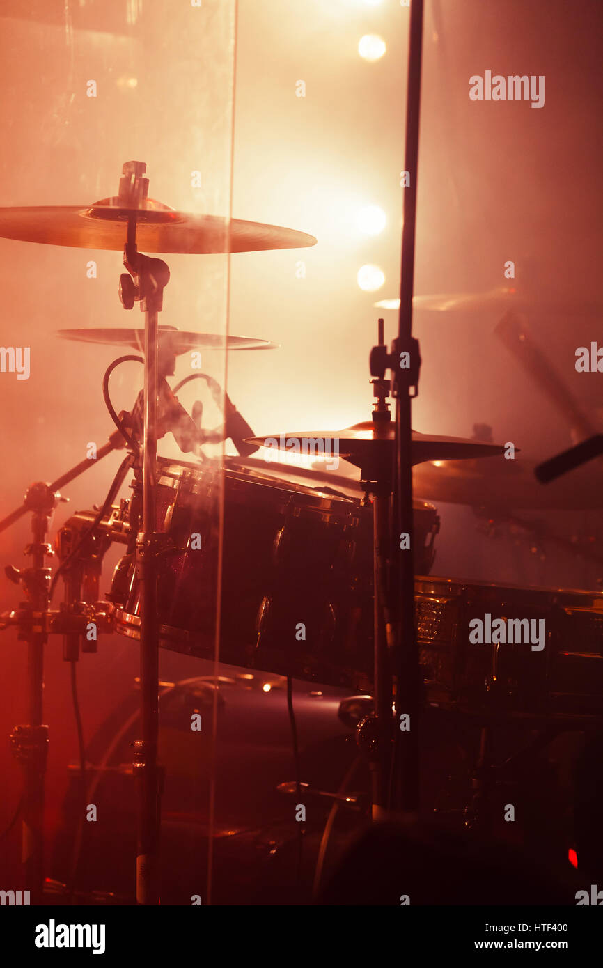 Live rock music background, rock drum set. Warm toned closeup vertical photo, soft selective focus Stock Photo