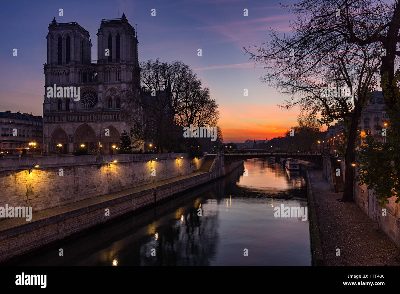 Notre Dame de Paris cathedral at sunrise with the Seine River. Ile de La Cite. 4th Arrondissement, Paris, France Stock Photo