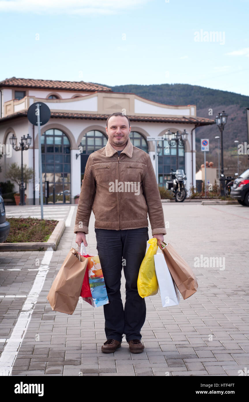 Man shopping bags hi-res stock photography and images - Alamy