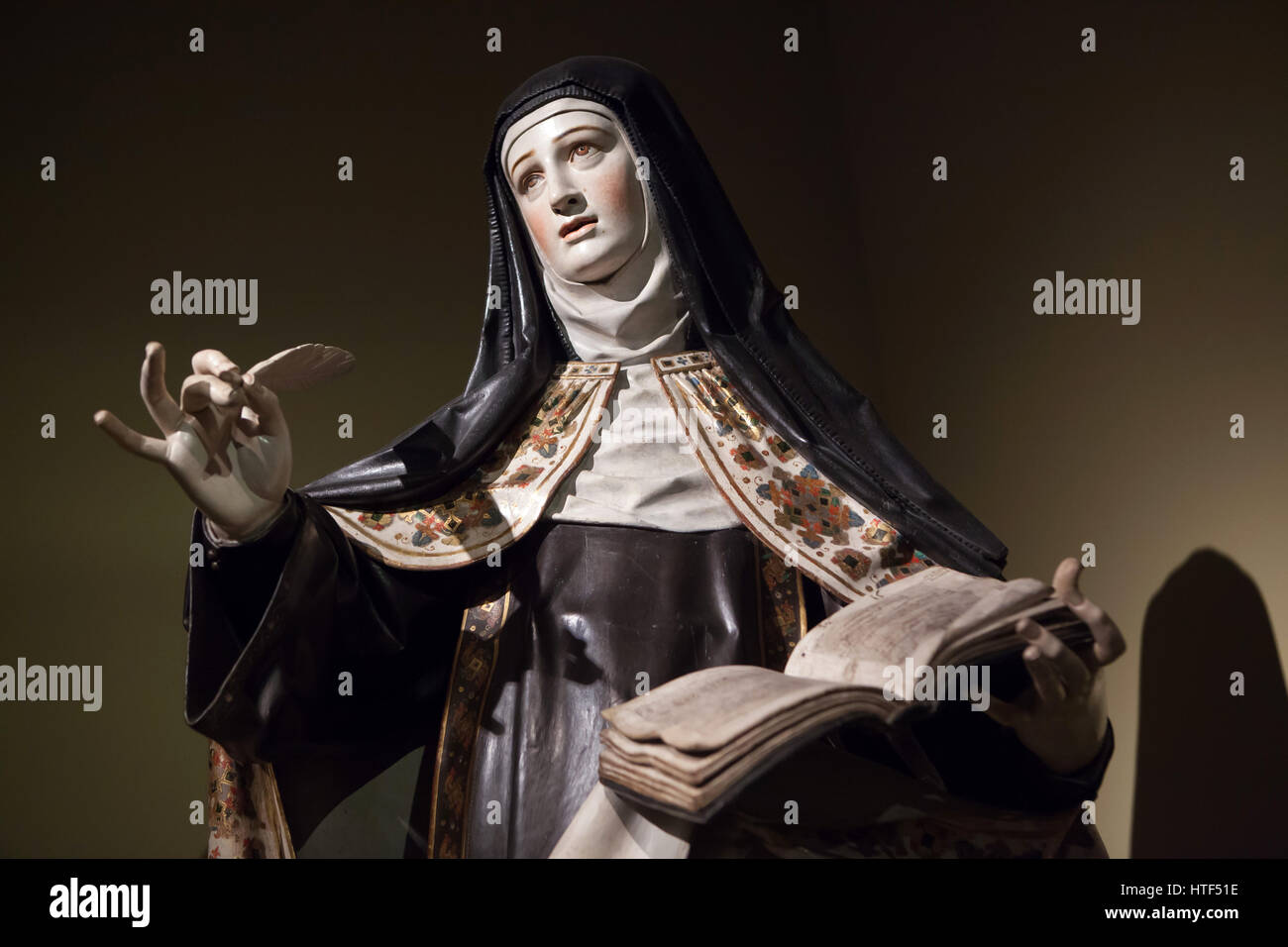 Saint Teresa of Avila. Polychrome wooden statue by Spanish Baroque sculptor Gregorio Fernandez (1625) on display at the exhibition in the Kunsthalle Munchen in Munich, Bavaria, Germany. The exhibition devoted to the Spanish Golden Age runs till 26 March 2017. Stock Photo