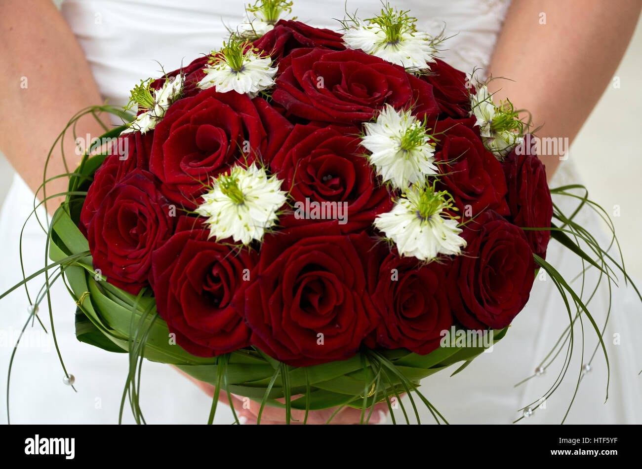 bride holding wedding bouquet with roses Stock Photo - Alamy