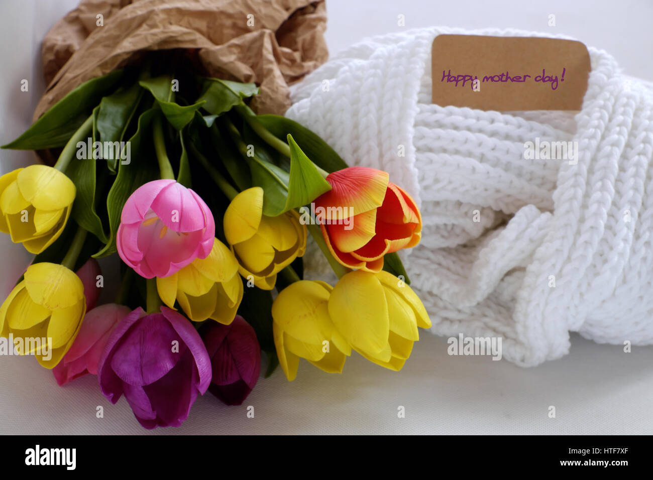Happy mother day, meaningful handmade gift with knitted white scarf, tulip flower bouquet from clay, gratitude and thank mom for love in special day Stock Photo