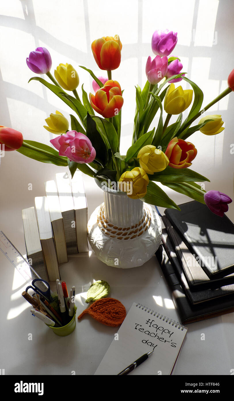 Happy teachers day, handmade tulip flower pot, stack of books, message