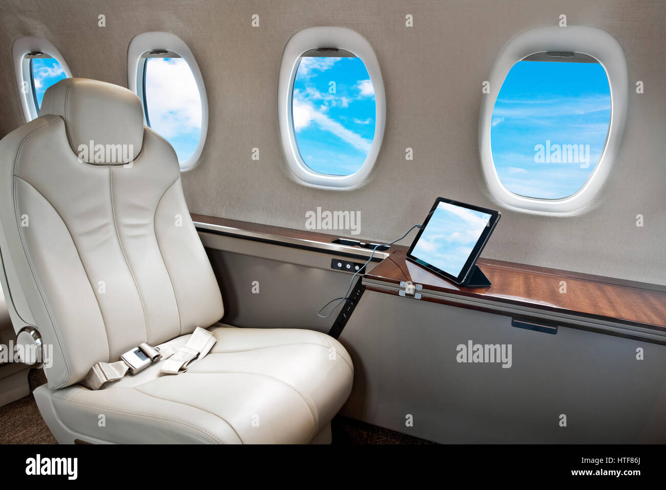 Clouds view in aircraft window, business jet flight Stock Photo - Alamy