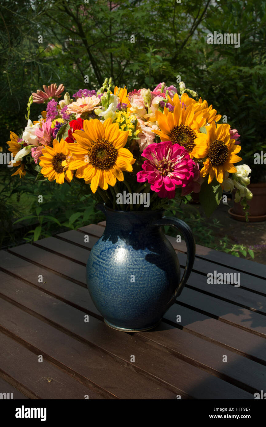 Red yellow and blue flowers in vase hi-res stock photography and images ...