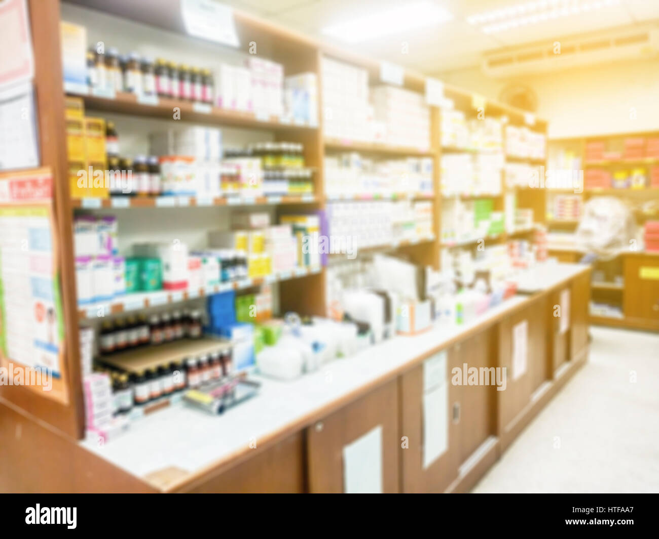 Blur abstract background inside pharmacy store with shelves of  pharmaceutical, cosmetic products and medical supplies: Blurry perspective  view of indo Stock Photo - Alamy