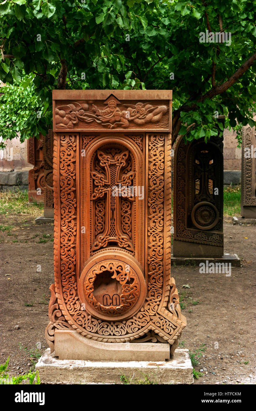 An old carved cross in tufa,Armenia.(Khachkar in the form of letters of the Armenian alphabet). Stock Photo