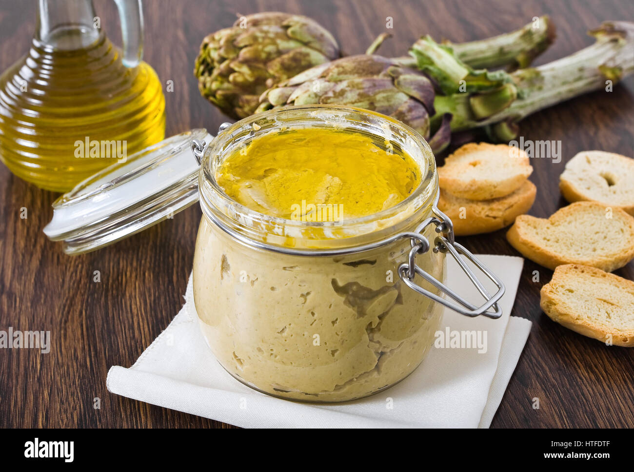 Artichoke pesto in glass jar Stock Photo Alamy