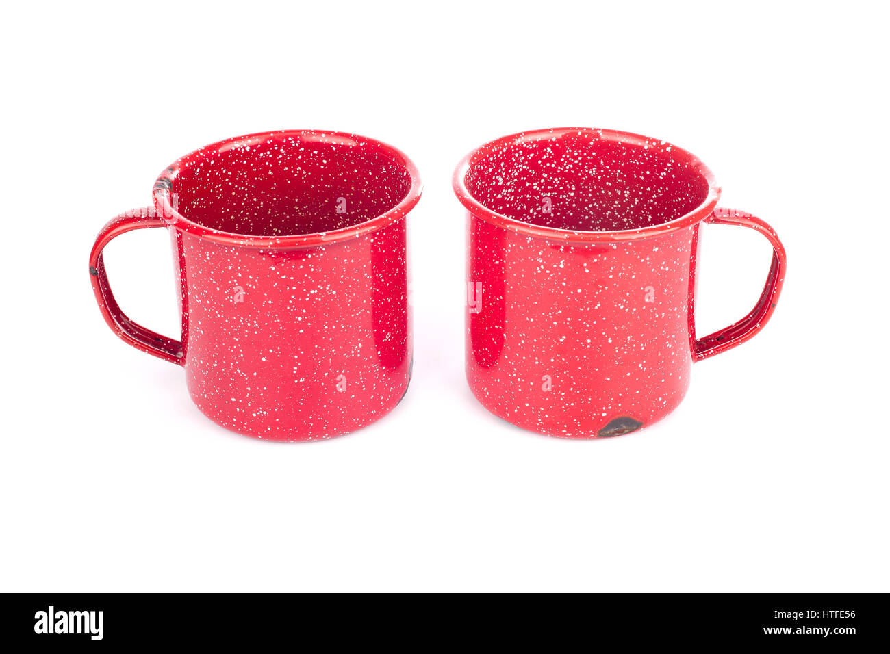 Two vintage red painted metal cups isolated on white Stock Photo Alamy