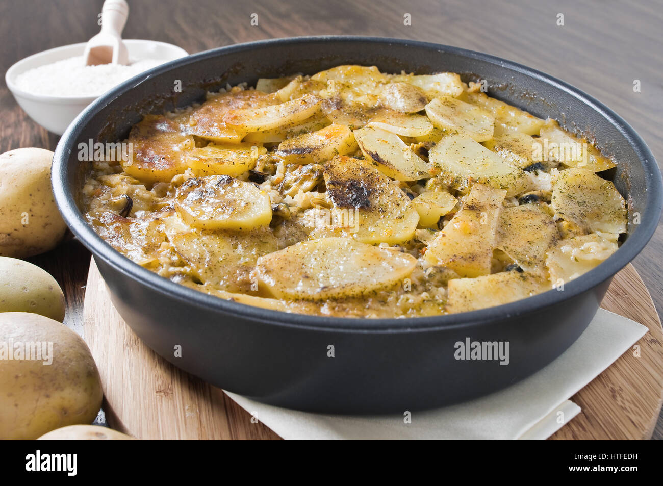 Tiella of potatoes, rice and mussels Stock Photo Alamy