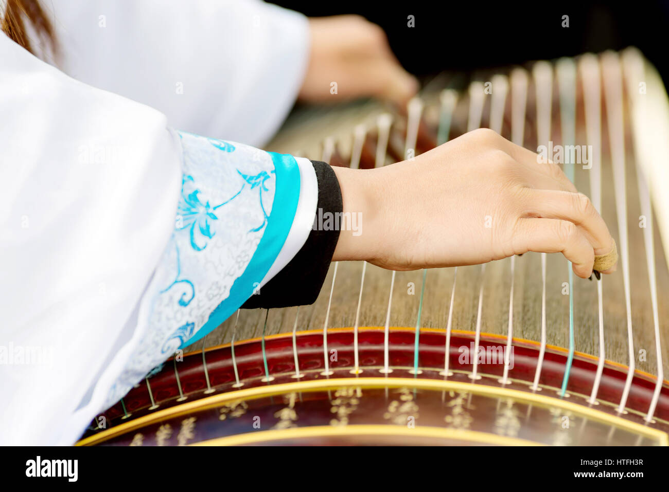 Girl playing chinese guzheng hires stock photography and images Alamy