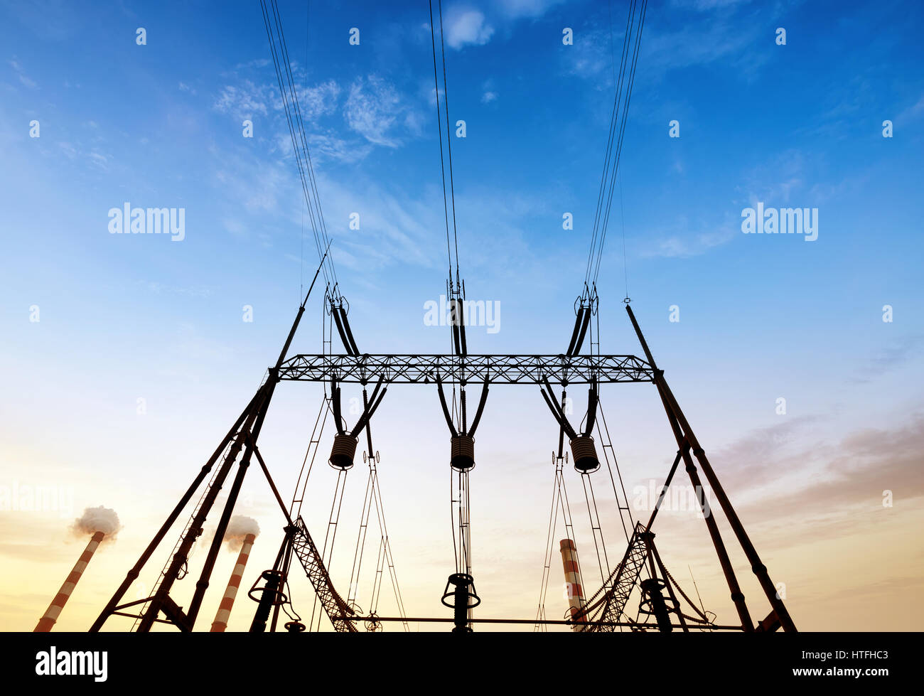 Converter station under dusk sky, electrical equipment and wiring Stock
