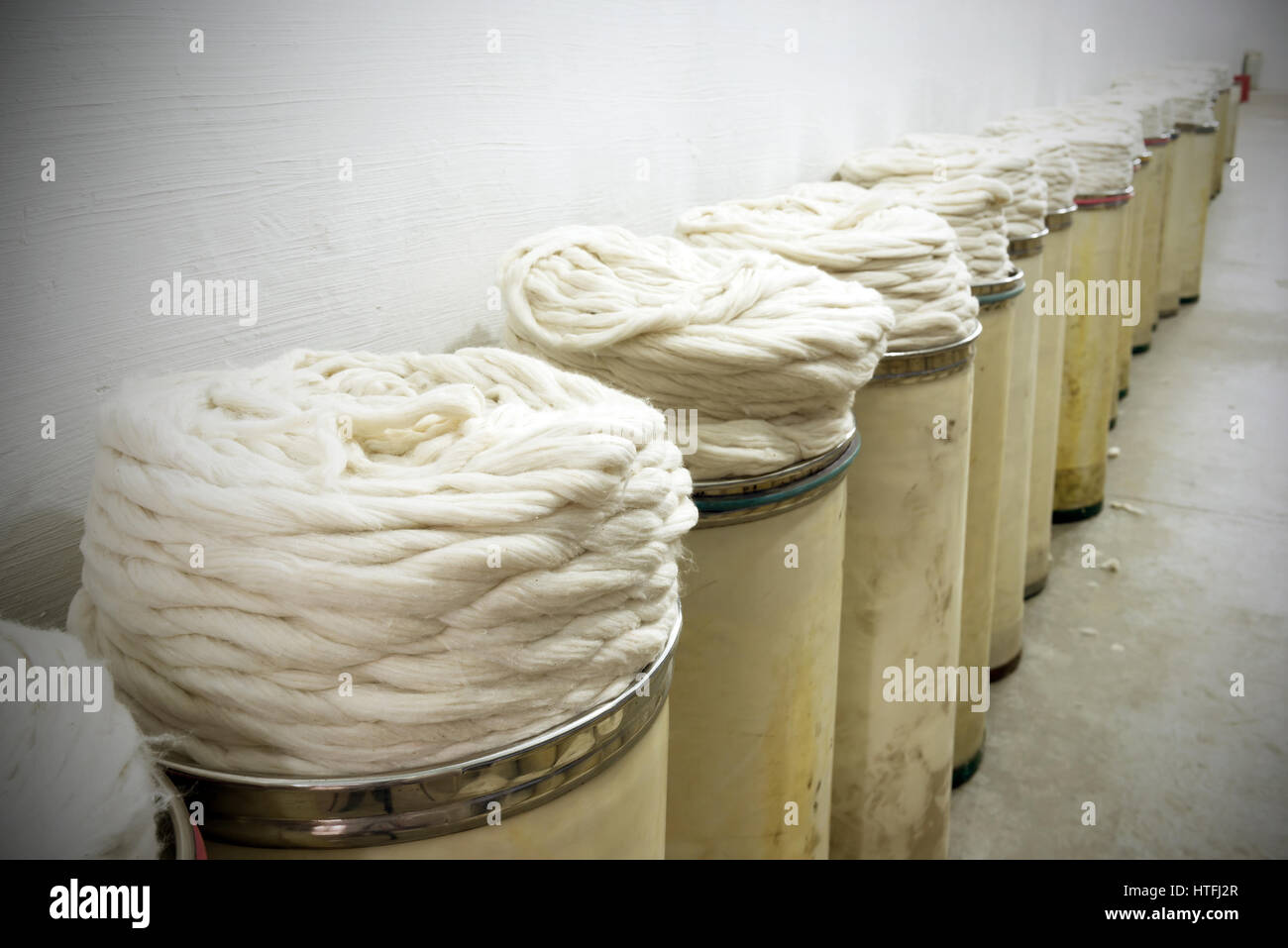 cotton group closeup in spinning production line factory Stock Photo