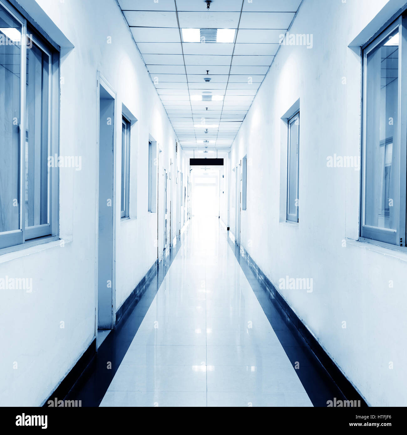 blue tone of long corridor in hospital. Stock Photo