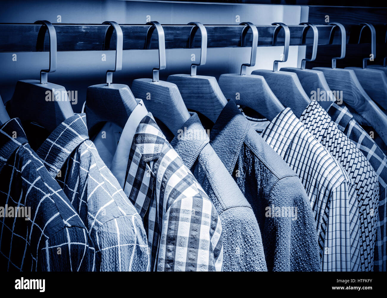 Mens blue shirt on hanger hi-res stock photography and images - Alamy