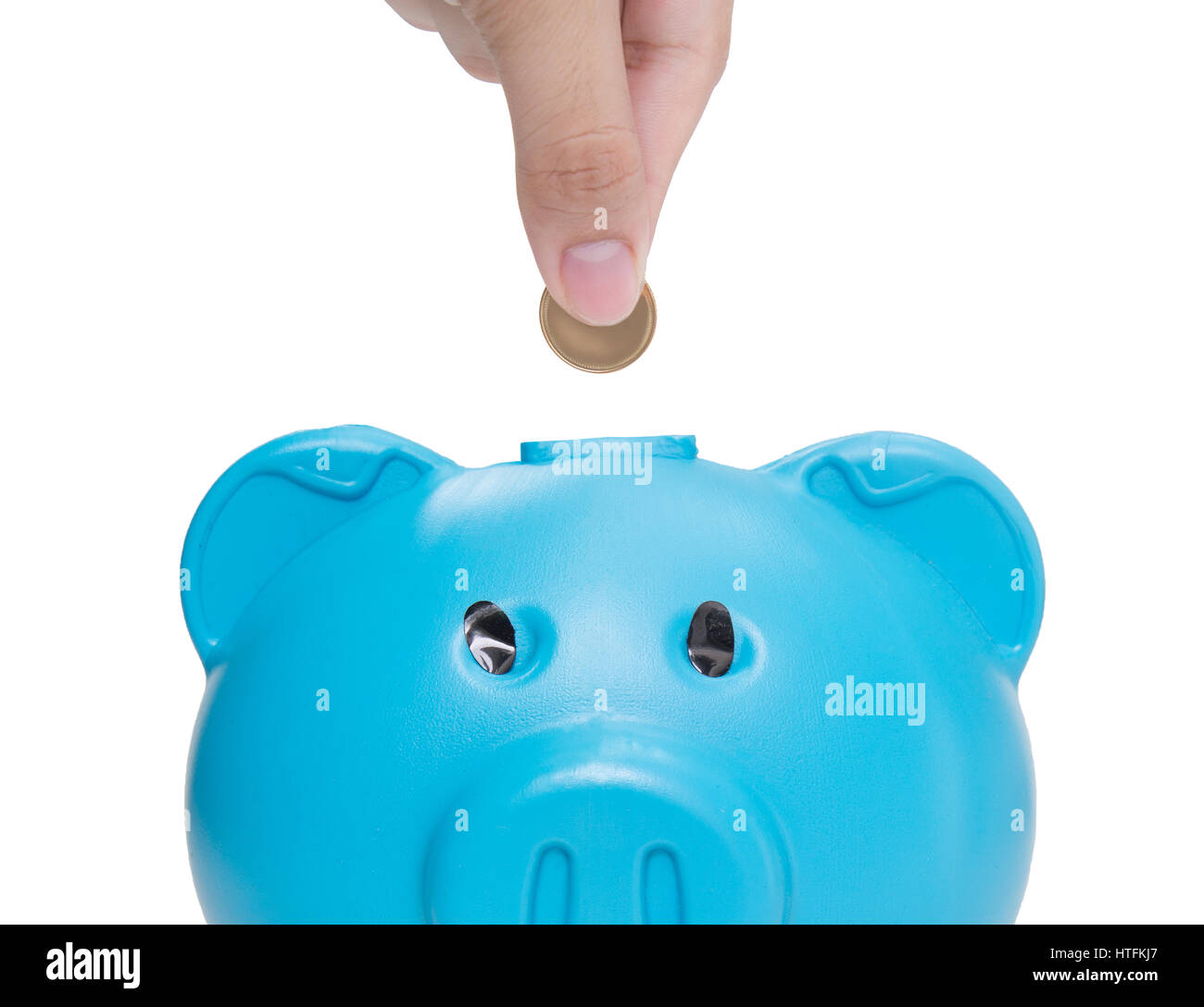 Hand putting coin into piggy bank on white background Stock Photo - Alamy