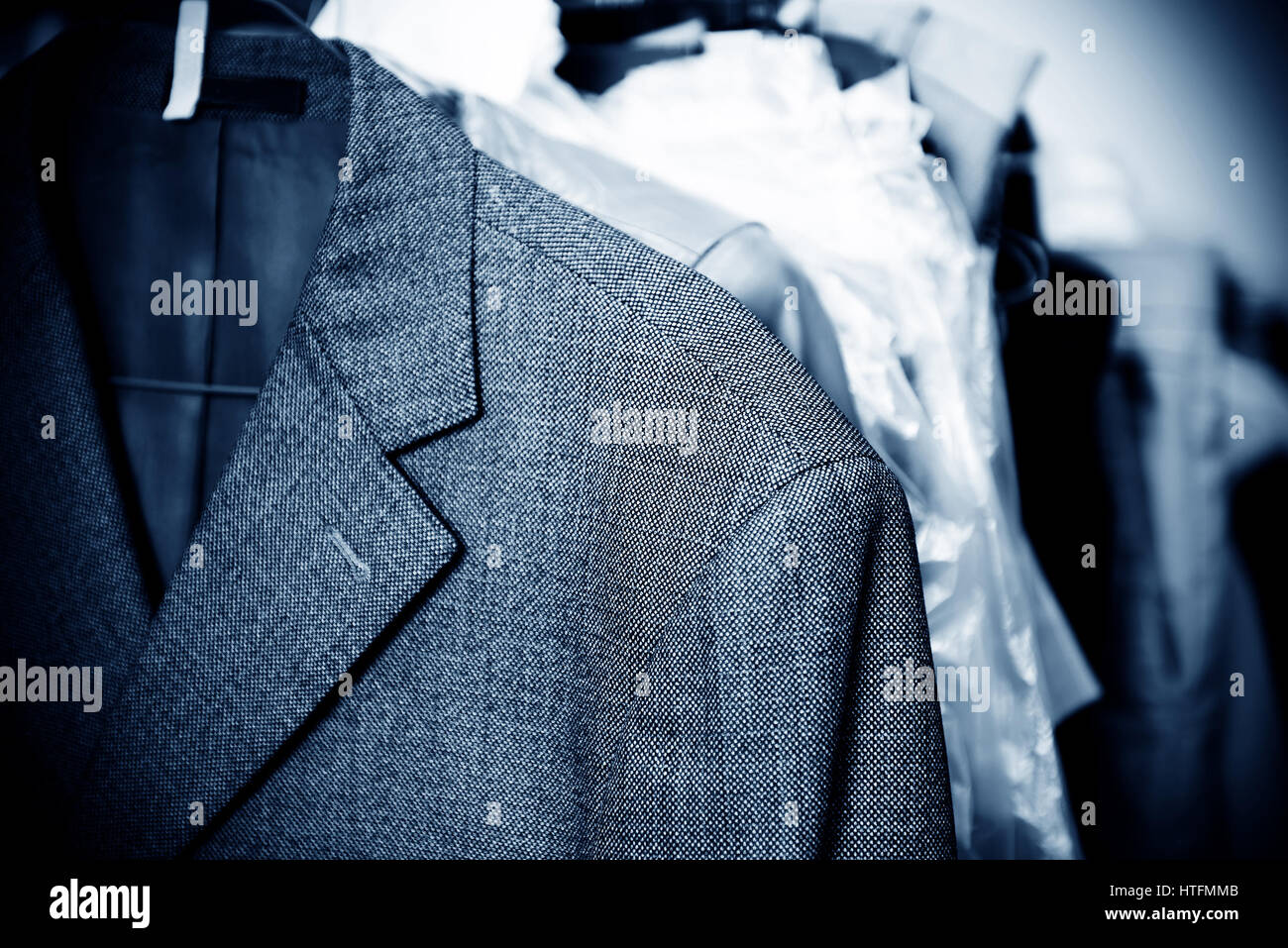 Laundry, hanging on the racks of old clothes Stock Photo - Alamy