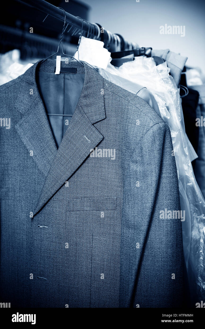 Laundry, hanging on the racks of old clothes Stock Photo - Alamy