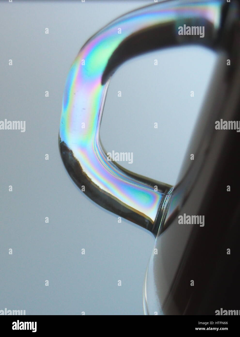 Close-up of glass cup and polarized light Stock Photo