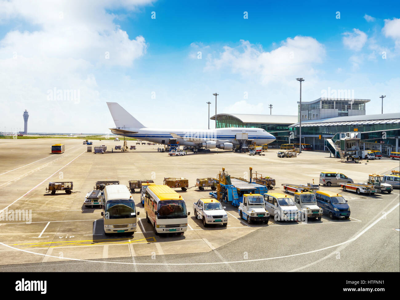 A passenger plane being serviced by ground services before next takeoff ...