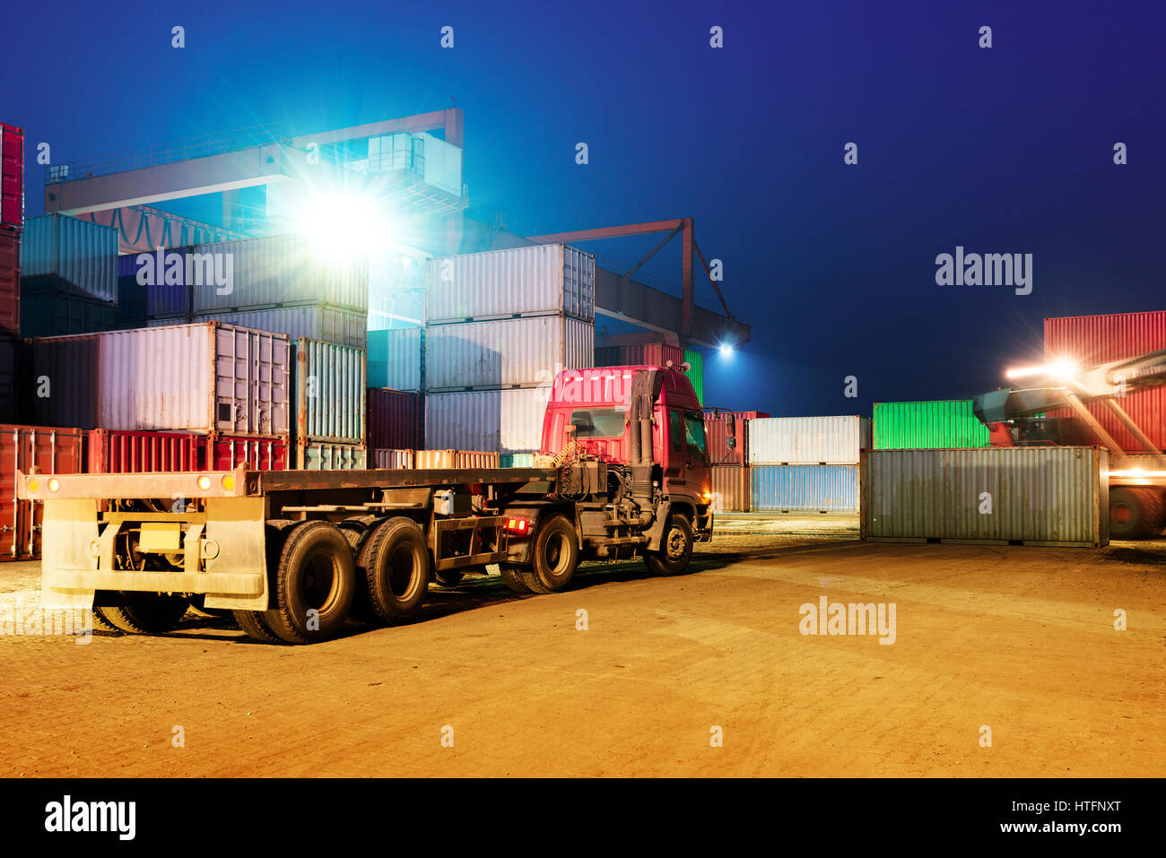 Container terminal at night, stopped working forklifts and trucks Stock Photo Alamy